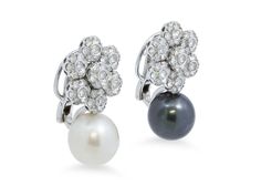 Each earring features a flower motif set with diamonds suspending a South Sea or Tahitian pearl, in 18k white gold with posts and omega backs. Signed PB for Pasquale Bruni. Luxury White Gold Clip-on Pearl Earrings, White Gold Pearl Clip-on Earrings For Evening, White Gold Clip-on Pearl Earrings For Evening, Evening White Gold Clip-on Pearl Earrings, White Gold Clip-on Pearl Earrings Fine Jewelry, White Gold Clip-on Pearl Earrings, Diamond And Pearl Earrings, Pasquale Bruni, Gold Baroque