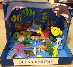 an ocean habitat made out of cardboard with sea animals and other marine life in it