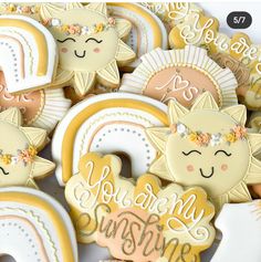 some cookies that have been decorated to look like the sun, moon and stars on them