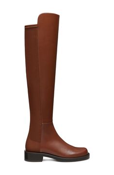 A stretchy back panel and over-the-knee silhouette amplify the modern appeal of a sleek leather boot balanced by a plain toe and stacked block heel. 1" heel (size 8.5) 22" shaft; 13 1/2" calf circumference. Narrow calf Leather and synthetic upper and lining/synthetic sole Made in Spain Stuart Weitzman 5050, Knee Boot, Leather Boot, Over The Knee Boots, Over The Knee, Stuart Weitzman, Calf Leather, The Knee, Leather Boots