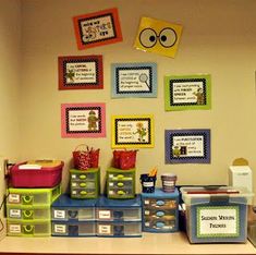 an image of a classroom display with pictures on the wall and words written in different languages