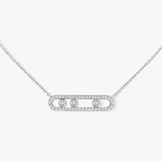 In this pavé version, this 18 carat white gold diamond necklace, fully handcrafted, and set with three 0.08 carat brilliant cut diamonds in motion is part of the Move women jewelry collection, icon of Messika House. This diamond jewel for women features a modern design, with a precious pavé cage and a double chain. the fine setting echoes back the white gold enhancing the stones purity. The three diamonds' movement, symbols of the love of yesterday, today and tomorrow, enlightens the luminous ef Long Diamond Necklace, Pave Necklace, Diamond Jewel, Precious Jewels, Gold Diamond Necklace, White Gold Necklaces, Necklace Sizes, Pave Diamonds, White Gold Diamonds