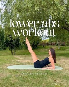 a woman is doing yoga in the park with her arms up and legs spread out