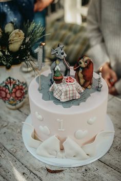 there is a cake that has animals on it