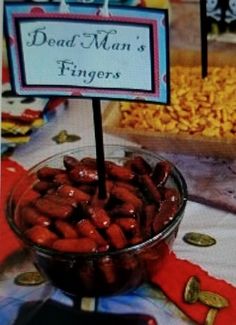 there is a sign that says dead man's fingers in front of some candy