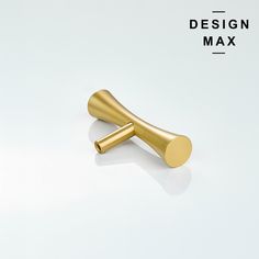 a gold colored dog bone on a white background with the words design max above it