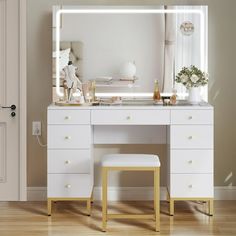 a white dressing table with a mirror and stool in front of it on top of a hard wood floor