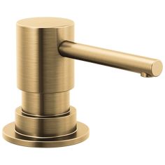 a brushed brass bathroom sink faucet with soap dispenser on an isolated white background