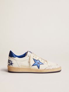 a white and blue sneaker with a star on the side