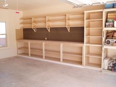 an empty room with shelves and boxes in it