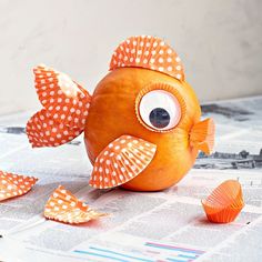 an orange fish with big eyes and polka dots on it's body is shown in the instagram