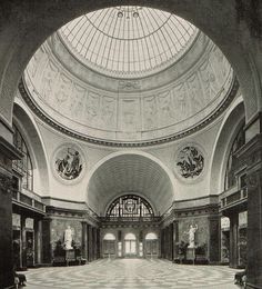 an old black and white photo of the inside of a building with checkered flooring