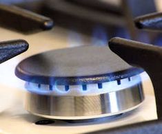 a close up view of the top of a stove with two burners on it