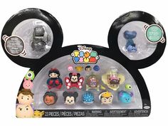 the mickey mouse head has many different toys in it's packaging, including figurines