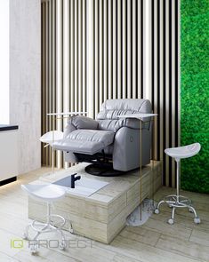 a living room with a couch, chair and ottoman in front of a green wall