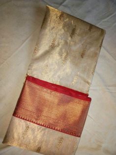 Tissue chanderi silk saree by svaada White Kanchi Pattu Saree, Tissue Kanchipuram Silk Saree, White And Red Saree, Red And White Saree, Kanchipuram Pattu Sarees, White Sarees, Cream Saree, Engagement Saree, Bridal Sarees South Indian