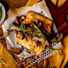 the meal is prepared and ready to be eaten on the wooden table with utensils