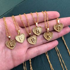 Initial Heart-Shaped Necklaces are pretty, shiny symbols of self love. These petit cuties are perfect for you or someone special in your life. Specifications: Metal: 14kt Gold Vermeil Chain Type: Water wave link chain Chain Length: 18 inches 🚐Delivery: US- 1-2 weeks International- 2-3 weeks B Design, Initial S, Heart Choker Necklace, Custom Initial Necklace, Gold Letter Necklace, Letter Pendant Necklace, Heart Shaped Necklace, Heart Choker, Initial Necklace Gold