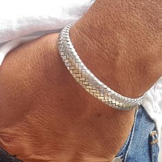 Impressive High-Quality Cuff Bracelet, made of Solid 925 Sterling Silver. PRODUCT SPECIFICATIONS Product ID: 11-0967-139 Metal Purity: Solid 925 Sterling Silver Free Size: It has an inside measurement of 6.3" / 16cm with a flexible opening gap. Width: 0.42" / 10.6mm Thickness: 0.18" / 4.7 mm Weight: 38g. Made in Thailand Included: Silver & Gold polishing cloth with lasting shine. Suitable for Men and Women. Mens Sterling Silver Jewelry, Modern Silver Jewelry, Mens Silver Jewelry, Mens Gold Jewelry, Mens Bracelet Silver, Silver Jewellery Sets, Sterling Silver Cuff Bracelet, Wire Weaving, Sterling Silver Mens