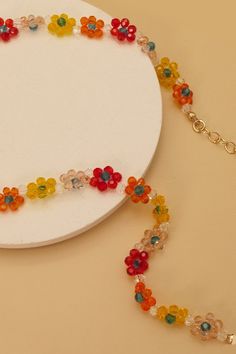 This crystal beaded flower necklace is perfect for any outfit! Woven with glass beads on strong fire line thread. Matching bracelet: 51B2062502Matching earrings: 51B2062580DIMENSIONlength: 13"charm size: .25"ext: 3" Ball Chain Extclasp: Lobster Clawmetal finish: Gold Platedproduct: Lead & Nickel Compliantanti-tarnish: Double E-coating Beaded Flower Necklace, Layered Chain Necklace, Sunglass Chain, Kids Necklace, Matching Bracelet, Square Pendant, Steel Necklace, Matching Bracelets, Beaded Choker