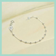 Sterling silver 925 rosary bracelet with cross and Miraculous medal. It is ideal for gift in any religious occasions.  Width of bead: 3 mm Weight of bracelet : 3 gr If you want to see the rest of our selection of beautiful bracelets, follow this link: https://www.etsy.com/shop/MedjugorjeJewelry?ref=shop_sections_curr&listing_id=1344945334§ion_id=40313966#items ...Or more of our other jewelry: https://medjugorjejewelry.etsy.com Silver Rosary, Beautiful Bracelets, Rosary Bracelet, Miraculous Medal, Rosary Beads, Virgin Mary, Rosary, Beautiful Bracelet, Silver Beads