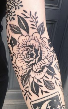 a person with a flower tattoo on their arm