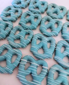 there are many blue donuts on the table