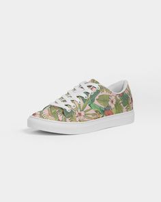 Women's vegan leather sneakers, vintage tropical floral print - perfect for spring, resort wear or comfy strolls on the boardwalk. Product Details Designed with comfort as top priority, our classic Women's Faux-Leather Sneaker is durable yet stylish. Its breathable lining and soft insole is made for all day wear and a timeless closet staple. Breathable lining, soft insole Lace-up front Padded collar, tongue Printed, cut, and handmade Size & Fit Runs TTS See size chart Material & Care Upper: Poly Summer Low-top Leisure Sneakers, Summer Lace-up Leisure Sneakers, Lace-up Sneakers For Leisure In Summer, Lace-up Leisure Sneakers For Summer, Leisure Lace-up Sneakers For Summer, Sporty Floral Print Sneakers With Round Toe, Casual Low-top Floral Print Sneakers, Comfortable Green Summer Sneakers, Spring Leisure High-top Sneakers