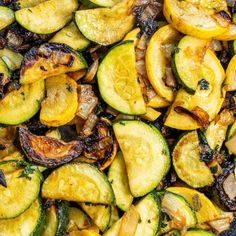 cooked zucchini and squash in a pan with seasoning on the side, ready to be eaten