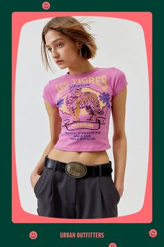 Baby tee with a Les Tigres printed at the front. Hits at the waist in a cropped silhouette with a crew neckline and cap sleeves. Find it exclusively at Urban Outfitters. Features Les Tigres graphic baby tee Tee with a Les Tigres graphic at the front Cropped silhouette Crew neckline UO exclusive Content + Care 100% Cotton Machine wash Imported Size + Fit Model in White is 5’10" and wearing size Small Measurements taken from size Small Chest: 24" Length: 17" | Les Tigres Baby Tee in Pink, Women's at Urban Outfitters Graphic Baby Tee, Baby Graphic Tees, Baby Tees, Small Chest, Baby Tee, Infant Tees, Crew Neckline, Cap Sleeves, Urban Outfitters