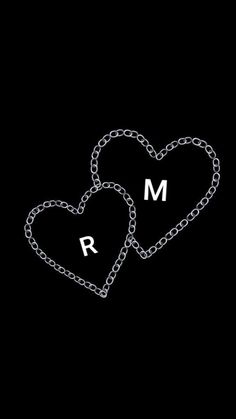 two hearts chained to each other with the letter m and r on them in chains