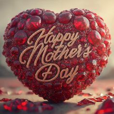 a red heart shaped object with the words happy mother's day written on it