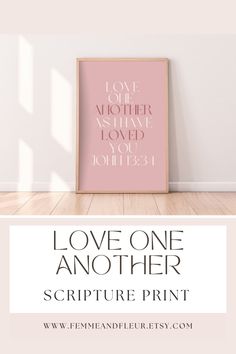 a pink poster with the words love one another and a white background