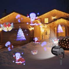 a house with christmas lights and decorations in the front yard, including an outdoor light project