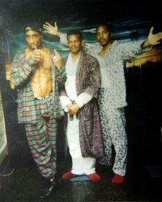 three men standing next to each other in pajamas