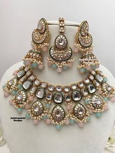 Premium quality Kundan Necklace comes with elegant Jhumki Earrings and Tikka/ trendy Indian bridal set/Premium Quality Polki and Kundan Jewelry/pink sky blue/pink feroza/pink surf  All items are shipped from Brampton, Ontario, Canada. If you need your item by a certain day, please reach out to us for express delivery option before placing the order so that we can update the shipping for you. Standard shipping/delivery timeline Below are the delivery timeline estimates. We dispatch all orders by Pink And Blue Indian Jewellery, Pink Bridal Jewellery Set, Luxury Multicolor Bollywood Jewelry Sets, Luxury Bollywood Multicolor Necklace, Luxury Multicolor Temple Jewelry Bridal Earrings, Luxury Pink Kundan Bridal Necklace, Luxury Pink Kundan Necklace, Pink Opal Jewelry, Pink Jewelry Set