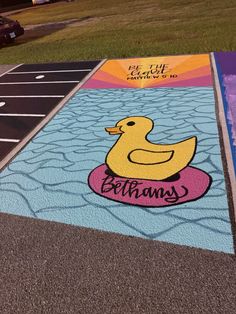 a painted parking lot with a rubber ducky on it