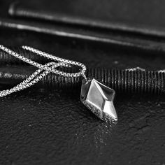 The Wishing Stone Necklace is a unique and imperfect steel pendant. The Wishing Stone resembles a mythical rock that is known to grant wishes when meditated on. This men's stone necklace is forged in premium grade 316L stainless steel and is waterproof, tarnish proof and hypoallergenic.  36mm x 23mm polished, matte and antique pendant 10mm thick 24 inch polished 3mm box chain Made of stainless steel   ► International orders are subject to tax/duty fees. This is uncontrollable on our end. Shipping can take up to 6 weeks due to customs. ► There are no returns/exchanges on sale items, personalized items, earrings, and custom length chains. ► For more information, please read our shop policies here on Etsy. Durable Metal Necklace As Gift, Durable Metal Necklaces As A Gift, Durable Metal Necklaces For Gifts, Durable Metal Necklace Gift, Durable Silver Jewelry Gift, Durable Stainless Steel Jewelry For Gift, Durable Symbolic Jewelry As A Gift, Symbolic Jewelry As A Gift, Durable Silver Necklace For Gift