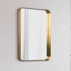 a mirror mounted to the side of a wall