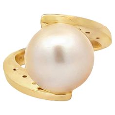 Ring Specifications: Metal: 18k Yellow Gold Total Weight: 11.1 Grams ​ ​Pearl Diameter: 13 mm ​ ​Pearl Count: 1 gold pearl Diamond Count: 10 brilliant cut Diamond Color: G Diamond Clarity: VS2 Diamond Carat Weight: 0.20 carats Ring Size: 6.75 (resizable) please message us to resize BEFORE purchasing Stamped: "18K" Ring Height: ~ 16 mm Condition: Preowned, excellent 100% Authentic. Please ask all questions before bidding or making a best offer. International Bidders please contact us before bidding for shipping availability and charges. Akoya Pearl Ring, Vintage Cluster Ring, Pearl And Diamond Ring, Vs2 Diamond, Diamond Carat, Sea Pearls, Halo Diamond Ring, Pearl Diamond, Diamond Cluster Ring