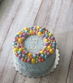 a birthday cake with colorful frosting and decorations