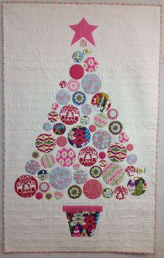 a quilted christmas tree with buttons on it