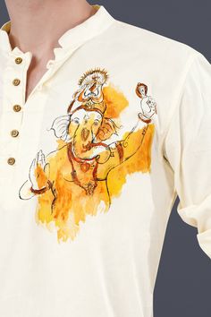 a man wearing a white t - shirt with an image of a cartoon character on it