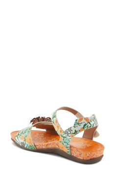 A whimsical floral appliqué adorns the vamp of a charming sandal fitted with adjustable straps for a customized fit. 1 1/4" heel Adjustable straps with hook-and-loop closures Cushioned footbed with arch support Leather upper/synthetic lining/rubber sole Imported Ankle Strap Sandals With Floral Print For Beach, Adjustable Flower Sandals For Spring, Adjustable Flower Sandals, Orange Strappy Heels, L'artiste By Spring Step, Latest Sandal, T Strap Flats, Spring Sandals, Spring Step Shoes