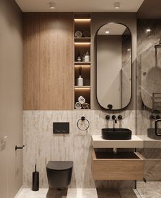 a bathroom with two sinks, a toilet and a large mirror on the wall above it