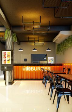 the interior of a fast food restaurant with tables and chairs in front of an orange wall