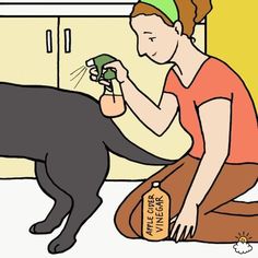 a woman kneeling down next to a black dog