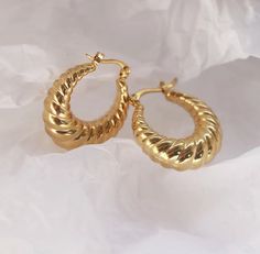 Add a touch of fun to your look with our Twisted Hallow Croissant Hoop Earrings! These earrings are not only light weight, but also incredibly cute and will never go out of style. Perfect for any occasion, these hoops will bring a playful twist to any outfit. They are made to last , hypoallergenic and waterproof 18K PVD Gold Plated 316L Stainless Steel 20mm Stylish Jewelry Gold, Vintage Gold Watch, Ornate Jewelry, Winter Wedding Guests, Jewelry Accessories Ideas, Pink Girly Things, Jewelry Inspo, Ear Jewelry, Jewellery Collection