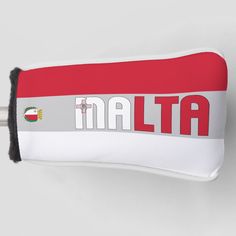 a red and white pillow with the word italia printed on it's back side