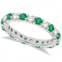 a white gold ring with emeralds and diamonds